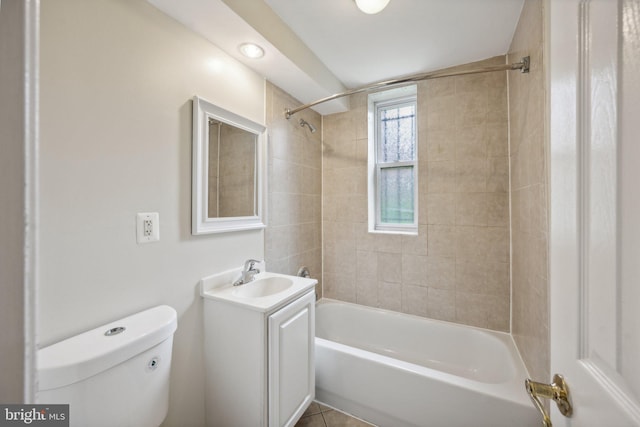 full bathroom with tiled shower / bath combo, vanity, toilet, and tile patterned floors