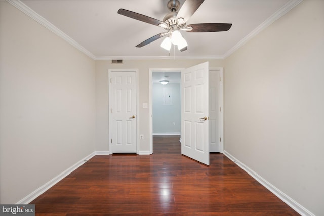 unfurnished bedroom with ceiling fan, ornamental molding, and dark hardwood / wood-style flooring