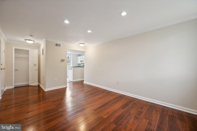 interior space with ornamental molding and dark wood-type flooring