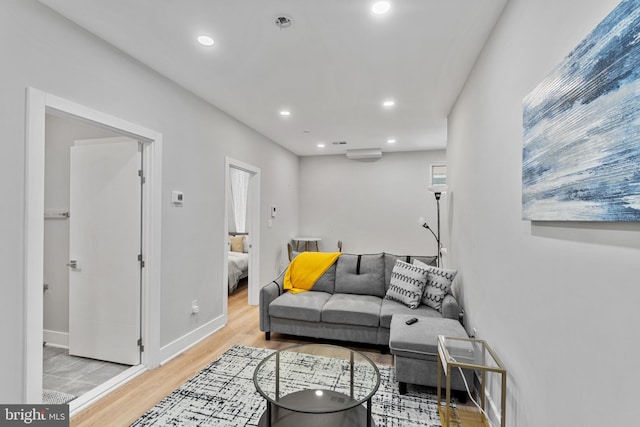 living room with light hardwood / wood-style floors