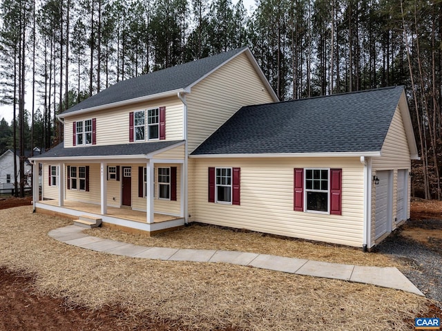 view of front of house with covered porch and roof with shingles