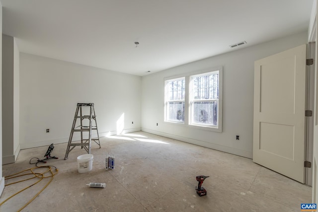 empty room featuring visible vents and baseboards