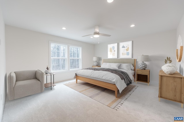 bedroom featuring light carpet, a ceiling fan, and recessed lighting