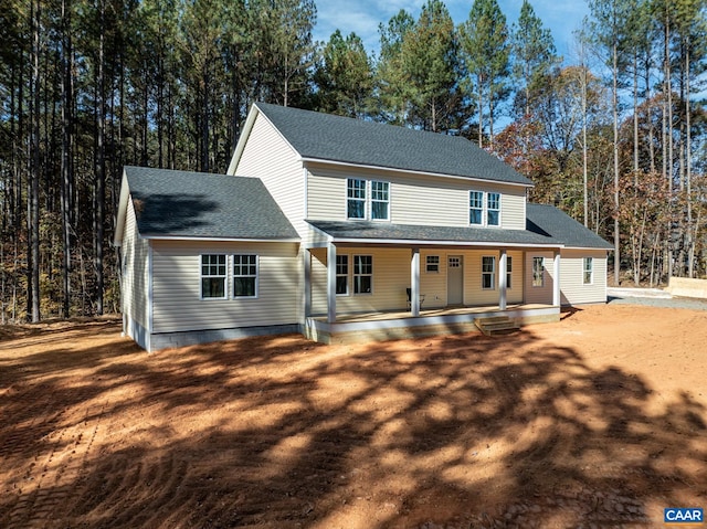 view of front facade featuring a shingled roof