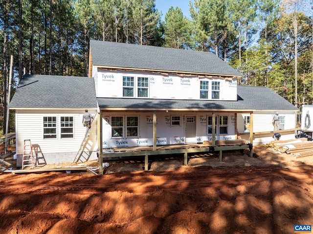 view of front of home with a shingled roof