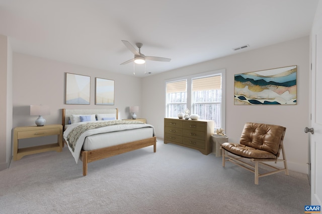 bedroom featuring light carpet, visible vents, and a ceiling fan