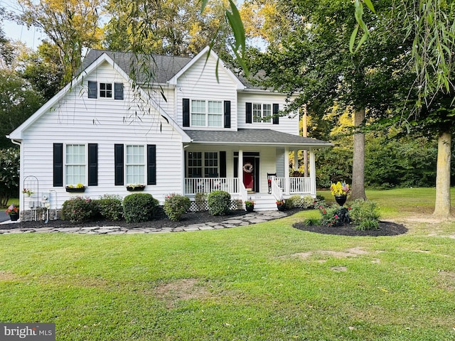 view of front of house with a front lawn and covered porch