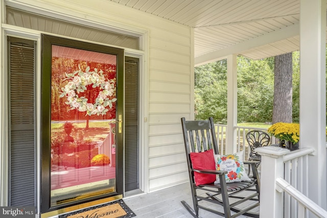 doorway to property featuring covered porch