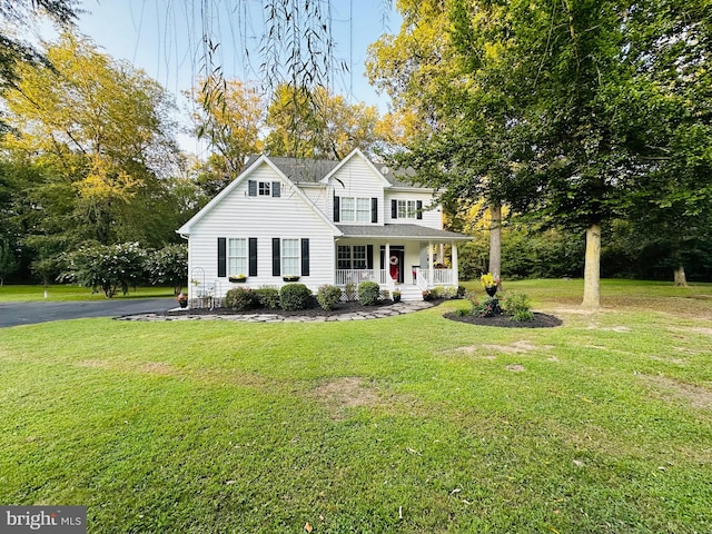 view of front of home featuring a porch and a front lawn