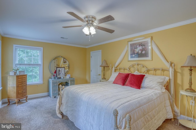 carpeted bedroom with visible vents, ceiling fan, crown molding, and baseboards