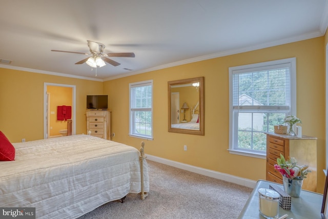 carpeted bedroom with ceiling fan, ornamental molding, and ensuite bathroom