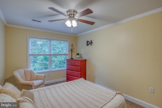 carpeted bedroom featuring crown molding and ceiling fan