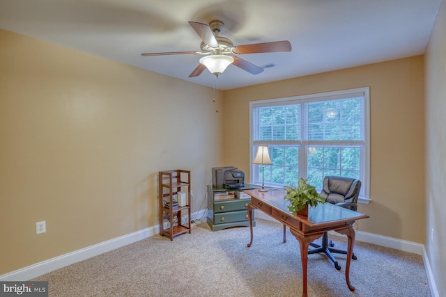 carpeted office with a ceiling fan, baseboards, and visible vents