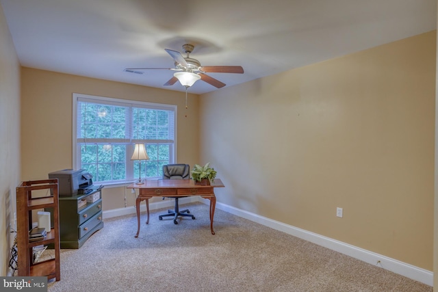 office featuring ceiling fan and light carpet