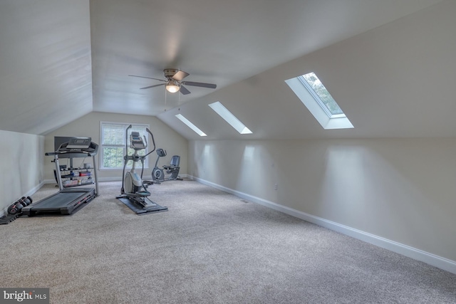 workout room featuring vaulted ceiling, baseboards, carpet floors, and ceiling fan