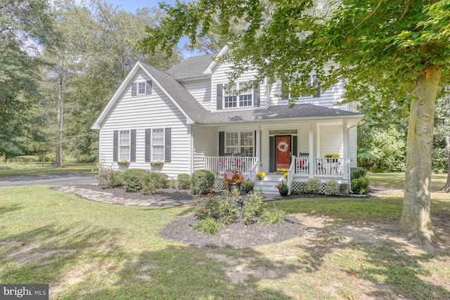 view of front of property featuring a porch and a front yard