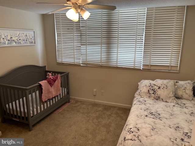 carpeted bedroom featuring a ceiling fan and baseboards