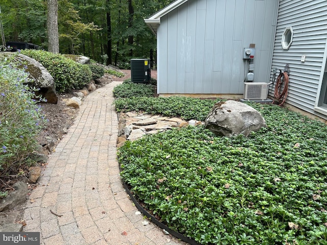 view of yard featuring central AC unit