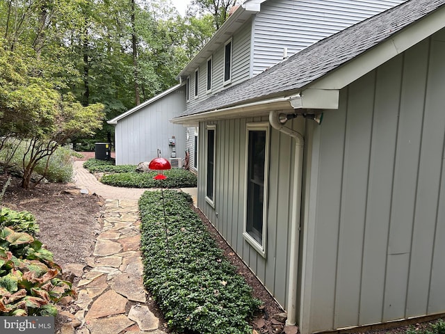 view of side of property with central AC