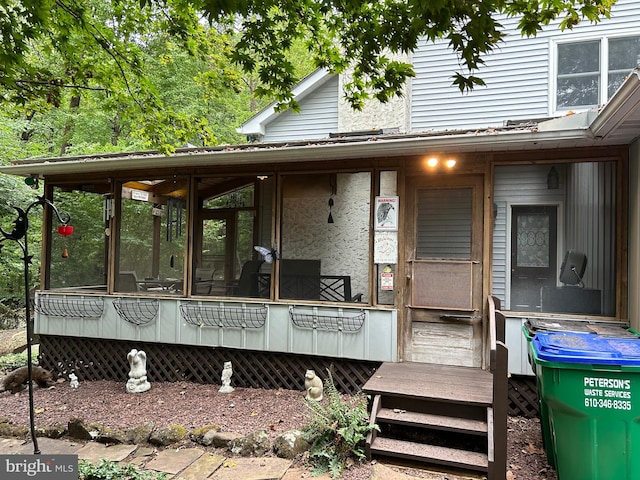 view of front of home with a sunroom