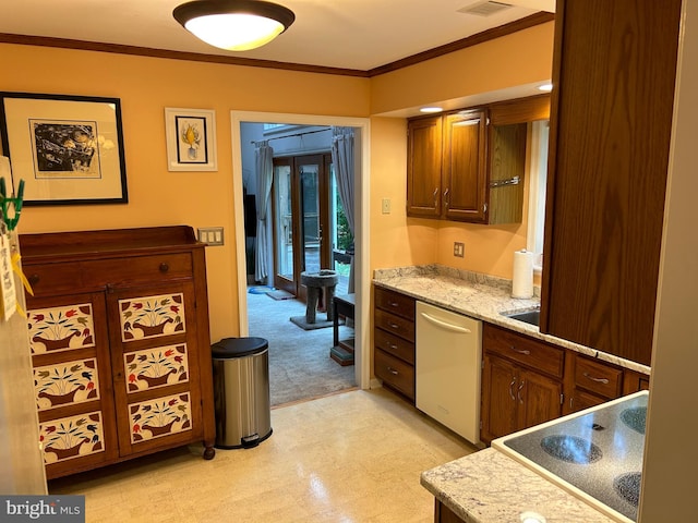 kitchen featuring cooktop, ornamental molding, and stainless steel dishwasher