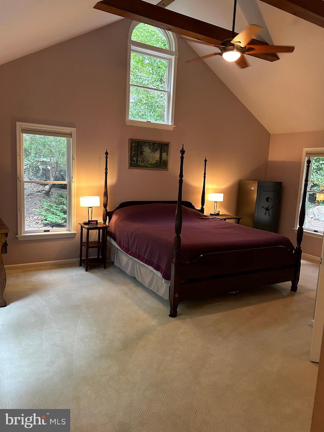 bedroom with high vaulted ceiling, multiple windows, ceiling fan, and carpet floors