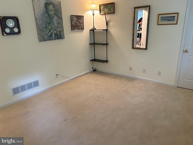 spare room with light colored carpet