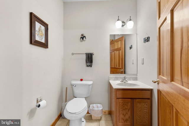 bathroom featuring vanity, toilet, and tile patterned floors