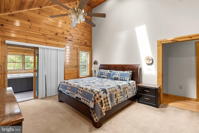 carpeted bedroom with wooden ceiling, high vaulted ceiling, and ceiling fan