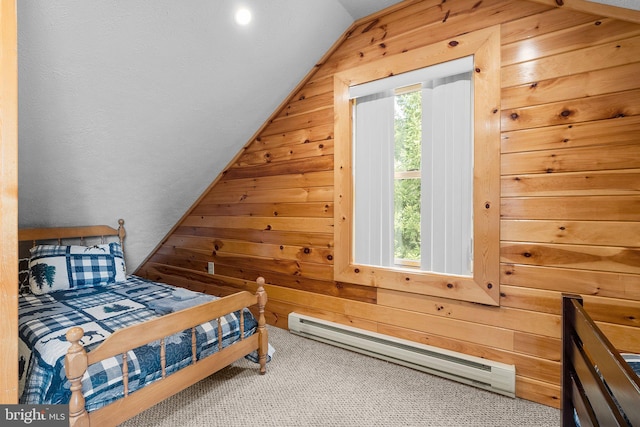 carpeted bedroom with a baseboard heating unit, wooden walls, and multiple windows