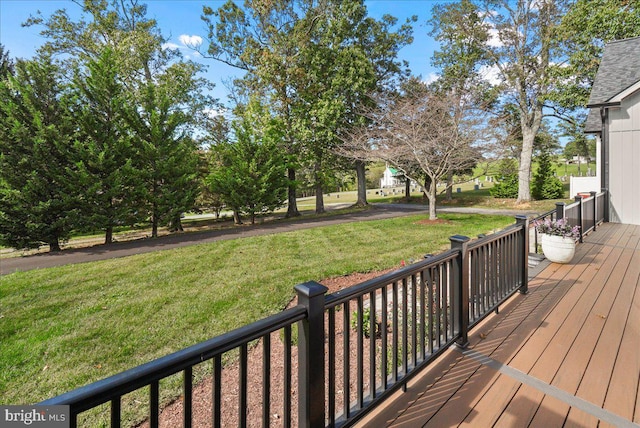 wooden deck with a yard