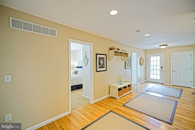 entryway with wood-type flooring