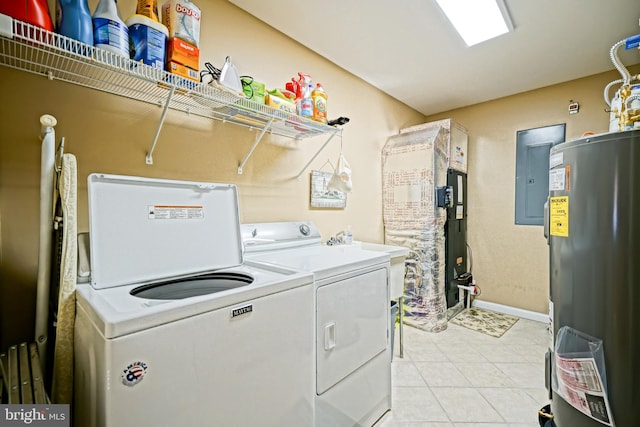 laundry area with electric water heater, electric panel, light tile patterned floors, and washing machine and clothes dryer