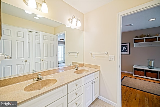 bathroom with wood-type flooring and vanity