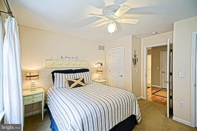 bedroom with ceiling fan and carpet floors