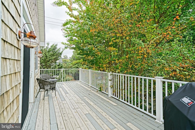 wooden terrace with grilling area