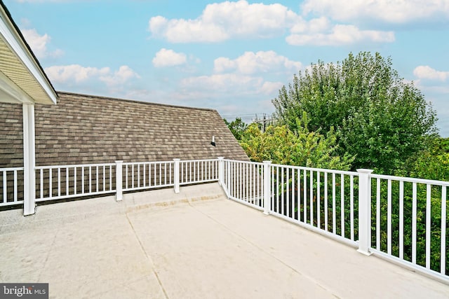 view of patio featuring a balcony