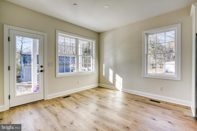 entryway with light hardwood / wood-style flooring