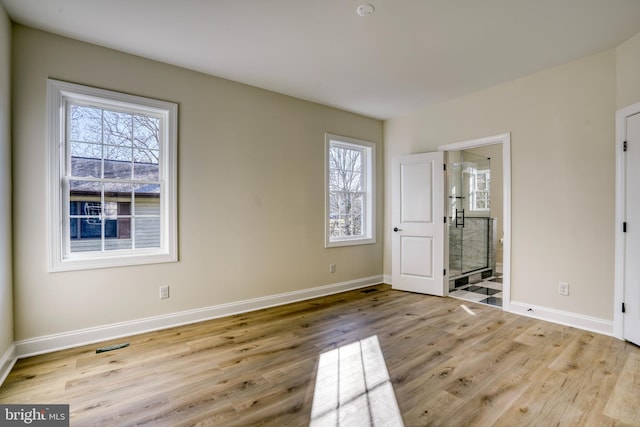 unfurnished bedroom with light hardwood / wood-style floors