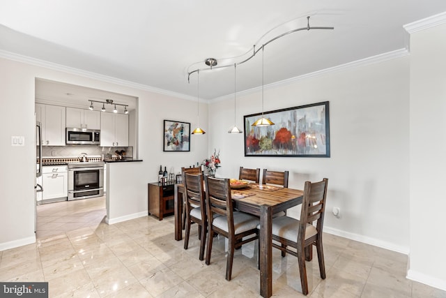 dining space featuring crown molding