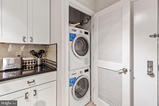 laundry area with stacked washer / dryer