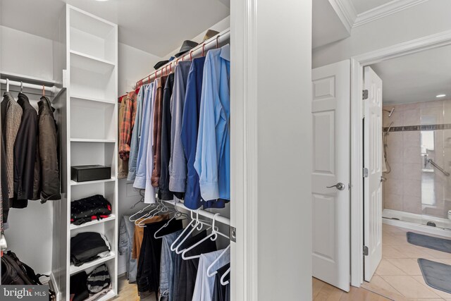 walk in closet featuring light tile patterned flooring