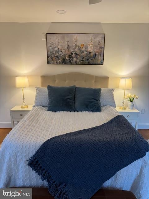 bedroom featuring dark hardwood / wood-style flooring