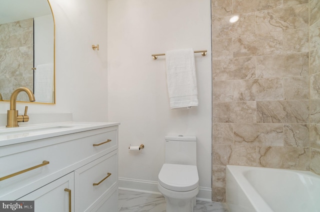 bathroom with toilet, a tub to relax in, and vanity