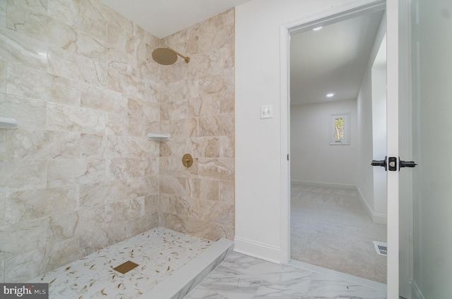 bathroom with tiled shower