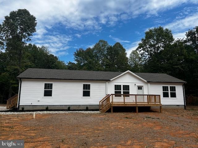 rear view of property with a deck