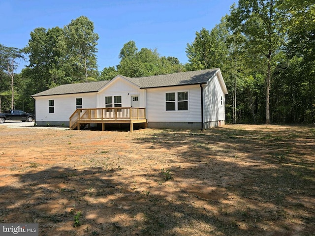 back of property with a deck