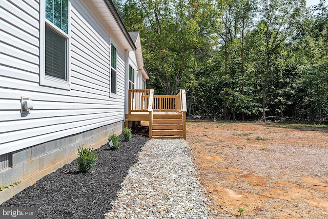 view of yard featuring a wooden deck