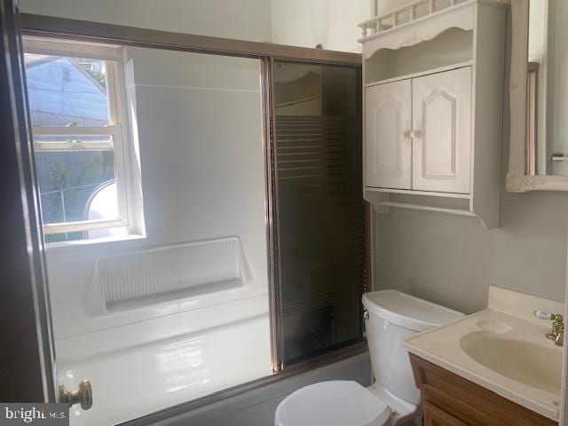 full bathroom with toilet, vanity, and combined bath / shower with glass door