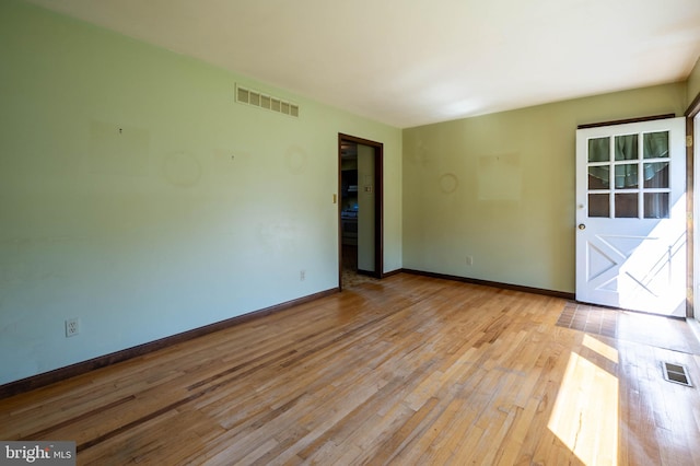 unfurnished room with light hardwood / wood-style flooring